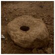 Excavation of a quern from one of the Romano-British ditches